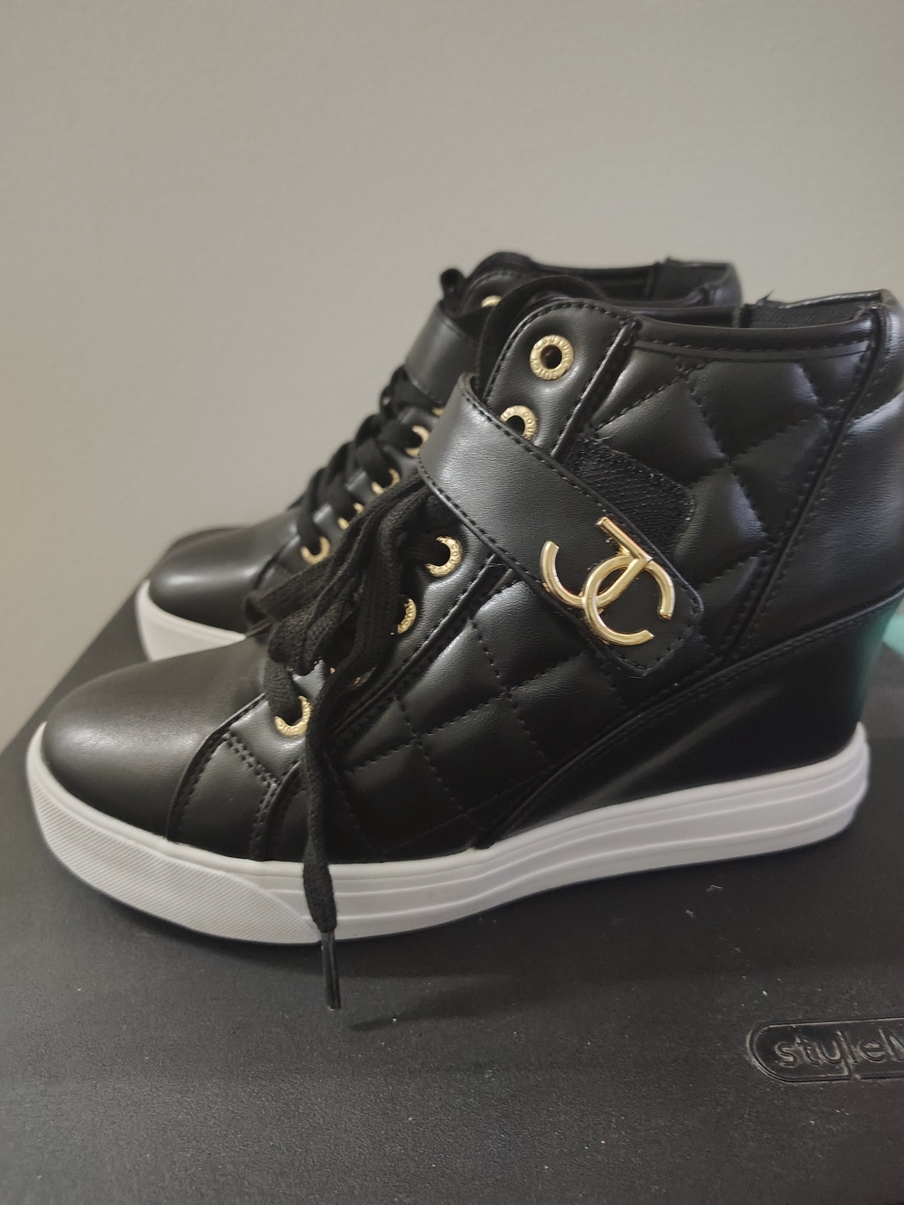 Black Quilted Wedge Sneaker with Gold Accent
